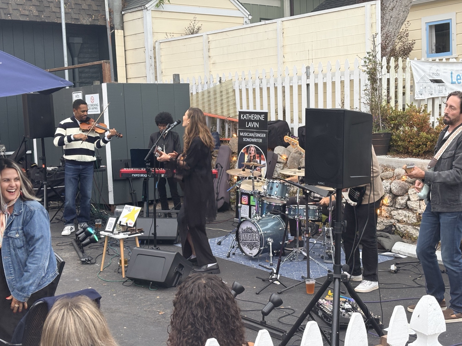 Katherine Lavin singing with her band outside Monarch Pub during First Friday in downtown Pacific Grove