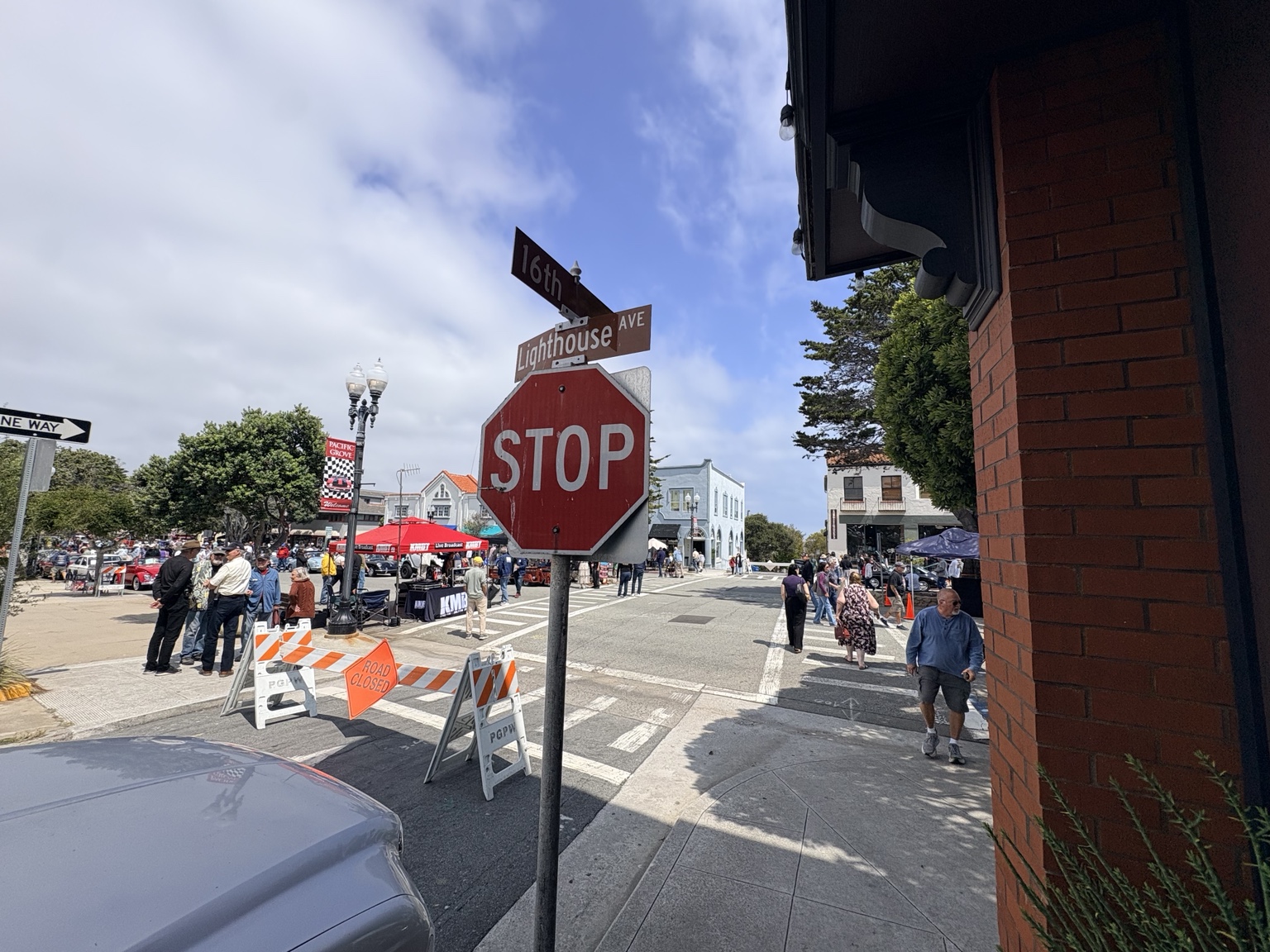Crowds, small cars and the KMBY broadcast tent on closed Lighthouse Avenue at 16th Street during the 2026 Little Car Show